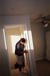 worker adjusts the door to the Kapolei Master Suite constructed by R. W. Almonte Enterprises